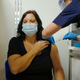 Deborah Cartmel receives the Covid-19 vaccine as the Royal Cornwall Hospital begin their vaccination program on December 9, 2020 in Truro, United Kingdom
